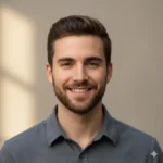 Catering 85 Portrait of Aaron D, young man with short brown hair and a friendly smile, soft neutral background, realistic lighting.