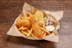 Home 106 Crispy battered fish fillets served with fries, tartar sauce, and creamy apple cider coleslaw.
