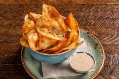 Happy Hour 11 Chef’s Chips seasoned with house secret spices, served golden and crispy with dipping sauce.