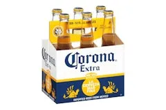 Home 204 Corona 6 Pack including six clear glass bottles of Mexican-style pale lager with golden color, housed in a white and yellow “Corona Extra” carrier.