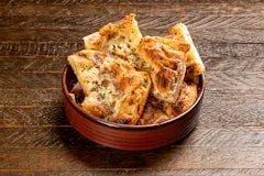 Happy Hour 12 House Bread baked fresh with garlic butter and herbs, served warm and fluffy.