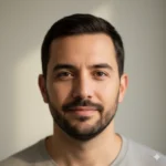 Catering 82 Portrait of Liam P, man with short dark hair and trimmed beard wearing a dark shirt, natural expression, simple plain background.