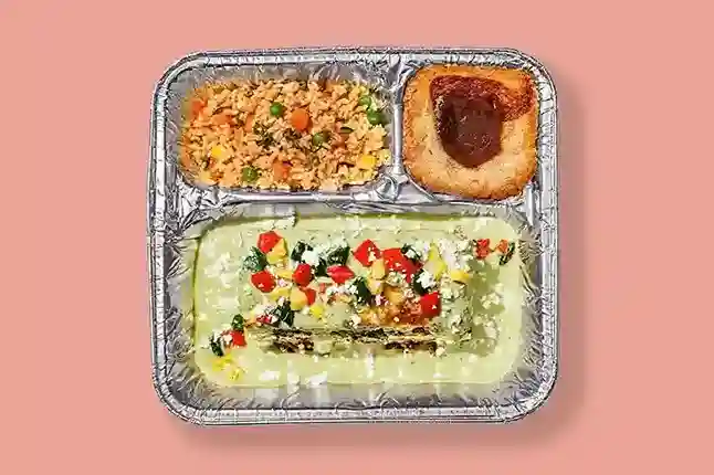 Home 193 Oven-Ready TV Dinner Spinach Enchilada Casserole made with layers of spinach, corn tortillas, poblano sauce, roasted peppers, and Spanish rice, served with churro butter cake.